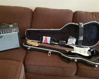 Fender electric guitar with amp, accessories, USA made