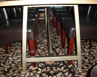 Metal supports under table