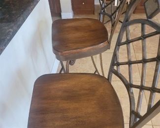 Two stools that match the dinette table and chairs