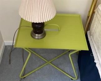 green modern-looking side table and lamp