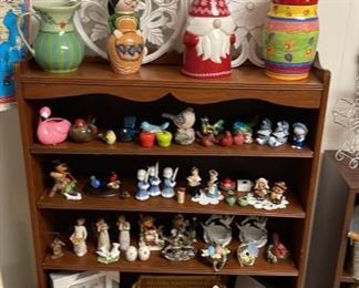 Figurines on vintage/ possibly antique shopping unit. Vases, picture, santa, oriental woman, hummel figurine, vintage salt and pepper shaker, willow tree angels, angel candles, birds that look like Lenox porcelain, framed doily art, brand new picture frame with birds