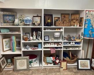 Two white wooden shelving units, figurines, decor, etc