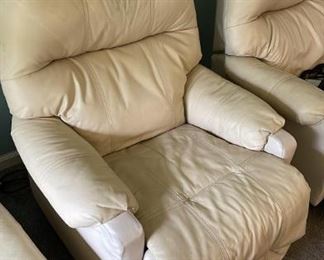 Two white leather recliners and Ottoman