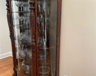 Antique Curved Front Curio with Carved Feet and Lion Head Accents