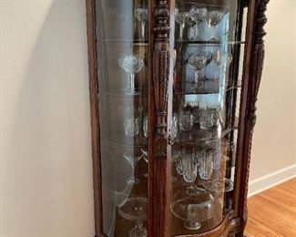 Antique Curved Front Curio with Carved Feet and Lion Head Accents