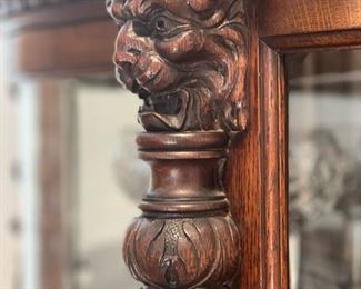 Antique Curved Front Curio with Carved Feet and Lion Head Accents