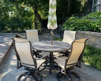 TROPITONE Banchetto Slat Aluminum Table with TROPITONE Montreux High Back Swivel Rocker Scroll Arm Chairs