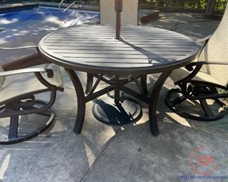 TROPITONE Banchetto Slat Aluminum Table with TROPITONE Montreux High Back Swivel Rocker Scroll Arm Chairs