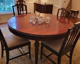 Mahogany Dining Table with 5 leaves and 6 Dining Chairs.