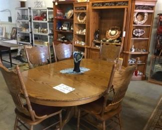 Antique oak dining room table with 5 chairs and a leaf