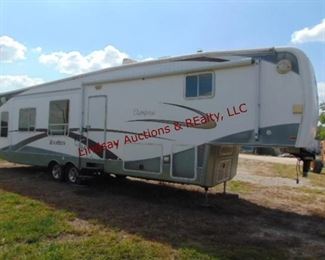 10/2007 NuWa Mod: 36 LK RSB Champagne "Hitch Hiker" fifth wheel camper w/ gooseneck adapater, 16,600lb GVWR, Vin# 1NWR058D07732C864, 4 slide outs, awning, propane, sofa sleeper, Queen bed, tv w/ dvd player & surround sound, desk/office area, 2 recliners, table w/ 4 chairs, Kitchen (includes: dbl door fridge/freezer, microwave, stove, oven, sink, etc), Full bathroom, washer/dryer unit, has Vacuflo central vac, roof heat/air, **HAS TITLE**
**HAS LEAKED AT ONE TIME (UNSURE IF ITS BEEN REPAIRED)**
**GOING TO NEED NEW TIRES**
**HAS BEEN SITTING INSIDE, HASN'T BEEN USED IN SEVERAL YEARS, CONDITION UNKNOWN**