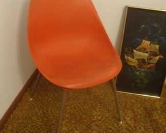 Molded plastic orange chair