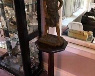 White metal figure on pedestal