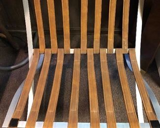 One of a pair of aluminum Barcelona style chairs with vinyl cushions