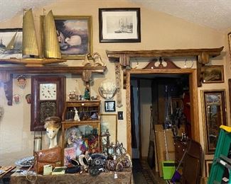 The shelves, the boat, photos, clock......zoom in on the purses on the table.  Check out the child size roll top desk