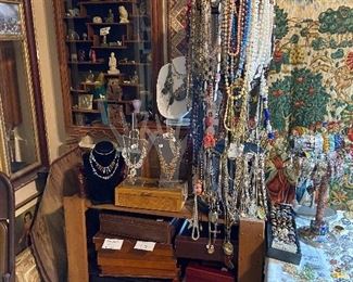 More necklaces and check out the beautiful wood and that glass small curio cabinet on the wall is a Japanese hardwood Netsuke cabinet