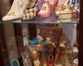Assorted ceramic/metal shoe collection.