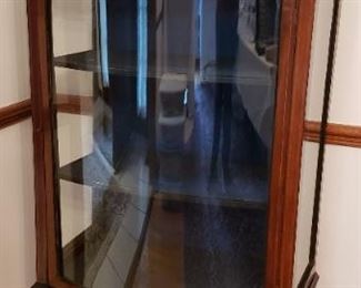 Rounded glass front and sides display case.