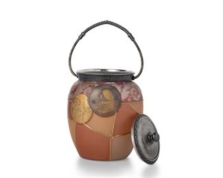 3004
A Mount Washington Royal Flemish Art Glass Biscuit Barrel
Circa 1890s; New Bedford, MA
With impressed "MW" mark to lid
The clear frosted glass jar decorated with gold enamel Roman coin designs on frosted maroon and yellow panels, fitted with a silver-plated lid and handle
10.25" H x 5" Dia.
Estimate: $500 - $700