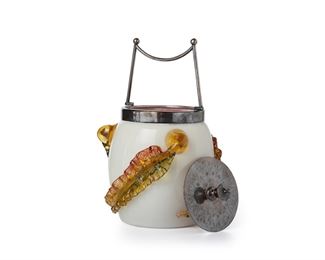 3020
A Stevens And Williams Art Glass Biscuit Barrel
Late 19th/Early 20th Century
The cased glass jar with pink interior and white exterior decorated with three applied amber and green leaves, fitted with a silver-plated lid and handle
9.25" H x 6" Dia.
Estimate: $300 - $500