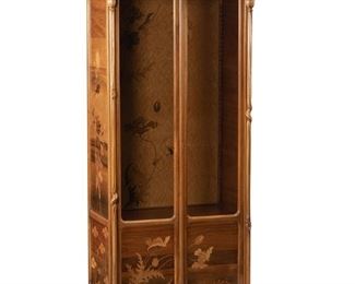 3032
Emile Gallé
1846-1904, French
A Vitrine Cabinet, Circa 1885-1904; Nancy, France
Inlaid signature: Gallé Nancy
The double-door glazed vitrine cabinet with extensive marquetry inlaid panels, front, sides, and interior, depicting poppies and dandelions
76" H x 36" W x 21" D
Estimate: $8,000 - $10,000