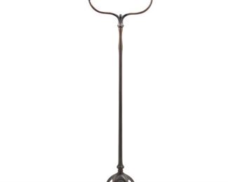 3039
Tiffany Studios
A Harp Floor Lamp, Circa 1902-1919; New York, NY
Base signed: Tiffany Studios / New York / 423 H
A single-light patinated bronze harp base with plain stem and floral socket cover raised on five curved legs with spade feet, electrified
Overall: 57.75" H x 16" Dia.
Estimate: $2,000 - $3,000