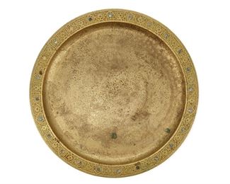 3041
Tiffany Studios
An "Abalone" Tray, Circa 1902-1919; New York, NY
Signed: Tiffany Studios / New York / 1728
The gilt-bronze tray with etched stylized floral border and inset mother-of-pearl discs
0.625" H x 14" Dia.
Estimate: $400 - $600