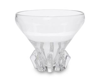 3047
A Steuben Crystal Bowl
Mid-20th Century; Corning, New York
With engraved signature to underside: Steuben
The clear lead glass bowl with wide, flared body and buttress-style feet
8.5" H x 10.25" Dia.
Estimate: $500 - $700