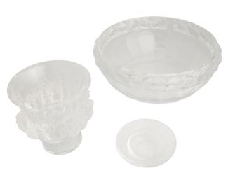 3050
Three Lalique Crystal Table Items
Three works:

A "Mésange" bowl
Circa 1945-1977
With engraved signature: Lalique France
Designed 1931, the clear and frosted lead glass bowl with a band of haute-relief meange bird
3.75" H x 10" Dia.

A "Dampierre" vase
Circa 1978-Present
With engraved signature: Lalique ® France
Designed in 1948 by Marc Lalique, the clear and frosted lead glass pedestal vase with haute-relief birds and leaves raised on a circular foot
4.75" H x 4.75" Dia.

An "Irene" ashtray
Circa 1978-Present
With engraved signature: Lalique ® France
Designed in 1931, the clear and frosted lead glass dish with a band of birds to the rim
1.125" H x 3.625" Dia.

3 pieces
Estimate: $800 - $1,200