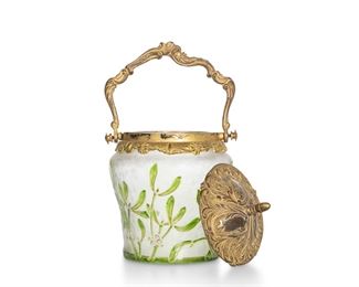3058
A French Art Glass Biscuit Barrel
Late 19th/Early 20th Century
The tapered jar with acid etched cut-back green mistletoe pattern over a frosted clear ground with gold enamel details fitted with a gilt-metal lid and handle
9.75" H x 5.75" Dia.
Estimate: $300 - $500