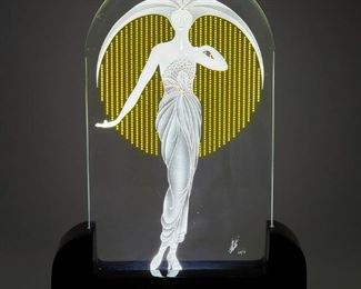 3076
Romain (Erté) De Tirtoff
1892-1990, Russian
"Le Soleil" Glass Luminaire, Circa 1980s
Glass and acrylic, electrified
Edition: 109/175
Glass with engraved signature and number: Erte
18.25" H x 13.25" W x 3.125" D
Estimate: $500 - $700