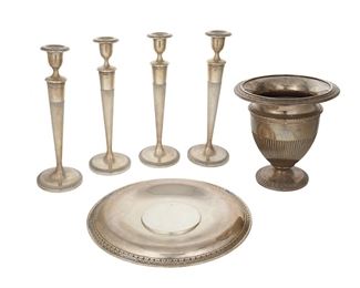 3080
A Group Of American Neoclassical-Style Sterling Silver Holloware
Circa 1921
Each marked for La Pierre and sterling; variously numbered; candlesticks marked: Patented / Oct 4 / 1921
Each with acanthus leaf borders and reeded bodies, comprising a large footed vase (9.125" H x 9" Dia.) and undertray (14.125" Dia.) with four weighted candlesticks (each: 14" H x 4.75" Dia.), 6 pieces
Weighable sterling: 49.65 oz. troy approximately
Estimate: $1,000 - $1,500