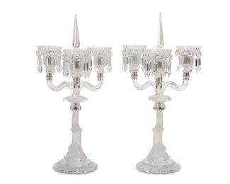 3082
A Pair Of Baccarat Crystal Candelabra
20th Century
Each marked for Baccarat
Each four-light, lead glass candelabrum with a Classical-style dolphin column issuing three scrolled arms and a central arm with a removable prism, 2 pieces
Each: 18.75" H x 12.5" Dia.
Estimate: $2,000 - $3,000