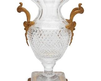3083
A French Clear Cut Glass Vase With Gilt Bronze Mounts
20th Century
Appears unmarked
Campana-form urns with square food and gilt bronze handles and foot
13" H x 9" W
Estimate: $800 - $1,200