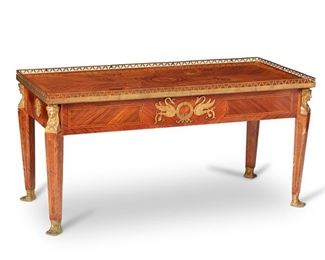 3087
A French Empire-Style Coffee/Cocktail Table
Late 19th/Early 20th Century
The table with bookmatched parquetry veneer, the top centering a marquetry medallion, and finished with a reticulated gilt-bronze gallery rail, raised on tapered legs with figural bronze mounts
21.5" H x 43.125" W x 19.75" D
Estimate: $1,000 - $1,500