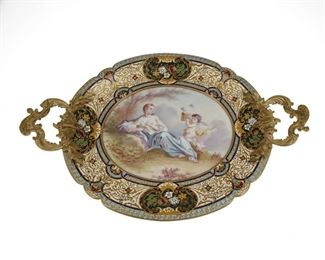 3090
A French Champlevé And Porcelain Tray
Fourth-Quarter 19th Century
Signed: S Paul
The gilt-bronze handled tray centering a painted porcelain plaque of a woman and a putto enclosed by a champleve enamel border
2.5" H x 14.25" W x 9.375" D
Estimate: $400 - $600