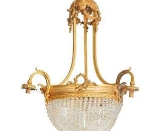 3100
A French Gilt-Bronze Chandelier
First-Quarter 20th Century
The six-light, gilt-bronze chandelier with acanthus leaves and floral festoons issuing three out-swept arms, each terminating in a drop pendant light, surrounding a central basin with glass bead chains containing three interior lights and decorated with laurel wreaths and crossed torches, electrified
33" H x 22" Dia. approximately
Estimate: $2,000 - $3,000
