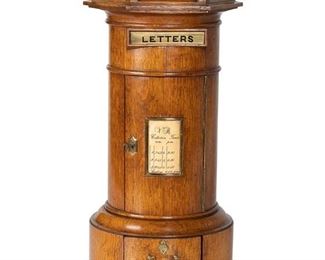3106
An Edwardian English Postal Box
First-Quarter 20th Century
The oak pillar-form box with brass mounts
16.5" H x 9.5" Dia.
Estimate: $400 - $600