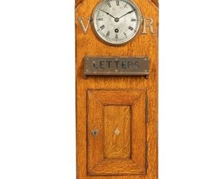 3108
An Edwardian English Postal Box Clock
First-Quarter 20th Century
The tall oak box with brass mounts centering a clock with metal dial, black Roman numeral hour markers and outer minute track, and single train movement
23.75" H x 10.25" W x 10.25" D
Estimate: $1,000 - $2,000