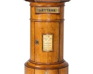 3109
An Edwardian English Postal Box
First-Quarter 20th Century
The oak pillar-form box with brass mounts
16" H x 9" Dia.
Estimate: $400 - $600