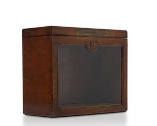 3111
An Edwardian English Postal Box
First-Quarter 20th Century
The narrow rectangular-form box with hinged top, glass front, and brass mounts
10" H x 12" W x 5.25" D
Estimate: $400 - $600