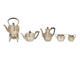 3114
A Victorian English Sterling Silver Tea And Coffee Service
1883-1889
Each marked with English hallmarks for London; maker's mark for William & George Sissons; tipping kettle and creamer with British registration marks
Each with chased foliate banding and wreaths, the kettles with carved wood handles, comprising a hot water tipping kettle with silver-plated burner and stand (13.25"), a coffee pot (8.875"), a teapot (6"), a sugar bowl (4.375"), and a creamer (4"), 5 pieces
87.48 gross oz. troy approximately
Estimate: $2,000 - $3,000