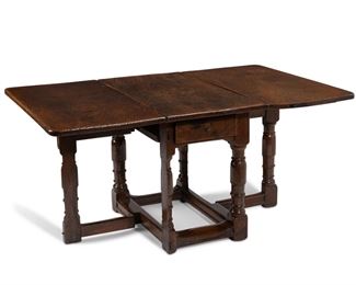 3122
An English Oak Drop-Leaf Gate Leg Table
18th Century
With a rectangular drop-lead top supported on pivoting gate legs with a single drawer
29.25" H x 39.5" W x 22.5" D; open: 64" D
Estimate: $1,000 - $1,500