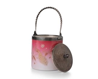 3124
A Victorian Art Glass Biscuit Barrel
Late 19th/Early 20th Century
Glass with Meriden B. Company stamp to underside
The peach blow cased glass jar with gold and white enamel flowers and a peacock, fitted with a silver-plated lid, handle, and foot
9.5" H x 5.25" Dia.
Estimate: $300 - $500