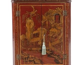 3135
A Chinoiserie-Style Lacquered Hanging Corner Cabinet
Mid-20th Century
The red lacquered corner cabinet with gilt decorations centering an architectural landscape scene, with two doors revealing two serpentine shelves
30.125" H x 23.5" W x 12" D
Estimate: $600 - $800