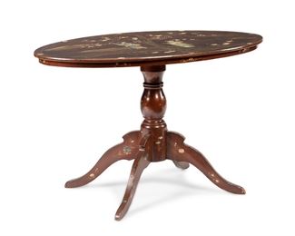 3136
A Chinoiserie-Style Tilt-Top Table
First-Quarter 20th Century
With a mother-of-pearl and enamel inset design of figures to oval top on pedestal base with four legs with mother-of-pearl inlay
29.5" H x 48" W x 28.25" D
Estimate: $600 - $800