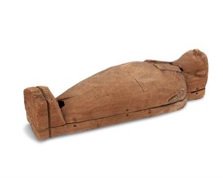 3137
An Ancient Egyptian Wooden Sarcophagus
Late Dynastic Period, 26th to 31st Dynasty
Unmarked
The rare hand-carved, likely cedar, lidded mummiform sarcophagus depicting a falcon bird or the god Horus, the lower section is joined via wooden pegs/dowels
21" H x 7" W x 6.75" D
Estimate: $3,000 - $5,000