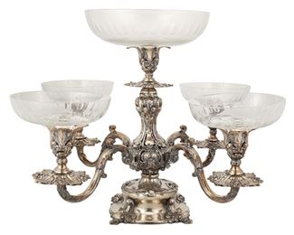 3146
A Continental Silver-Plated Epergne
19th Century
With a sliver-plated foliate-style base issuing four scrolled arms fitted with thumbprint pattern cut glass bowls
14.75" H x 22" W x 22" D
Estimate: $1,500 - $2,000