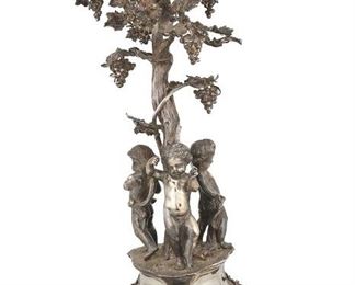 3148
An English Silver-Plated Centerpiece
Fourth-Quarter 19th Century
With three dancing putti around a tree supporting a later-added cut crystal bowl
25" H x 12" Dia.
Estimate: $800 - $1,200