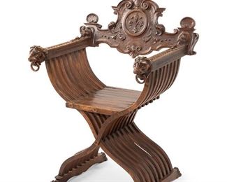 3157
A Carved Wood Savonarola Chair
Late 19th/Early 20th Century
The armchair with carved lion's head arms on an X-form support
39.5" H x 28" W x 22" D
Estimate: $400 - $600